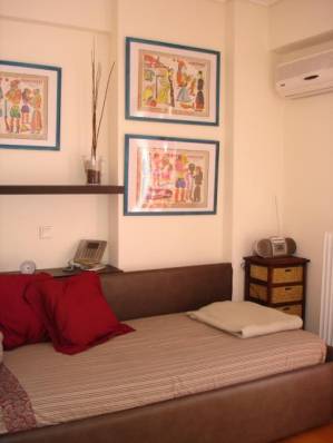 Two twin beds in second floor bedroom - Athens Vacation Apartments