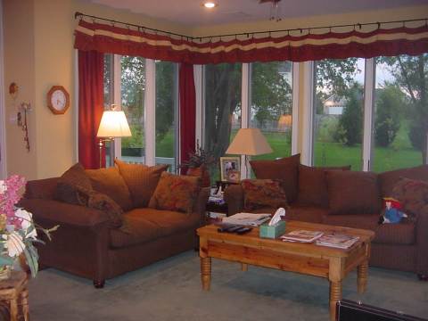 another view of the sun room with flat screen TV