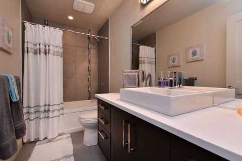 Main bathroom with tub and shower combination.